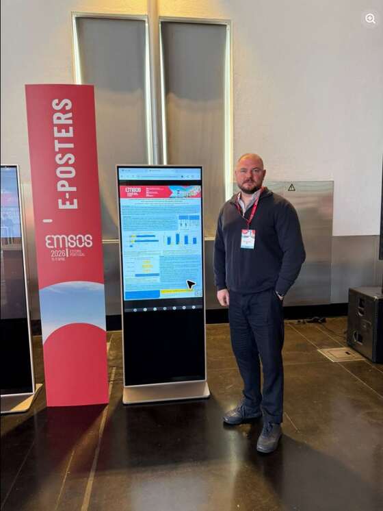 Ihor Tkachenko at the EMSOS 2026 e-poster area in Estoril